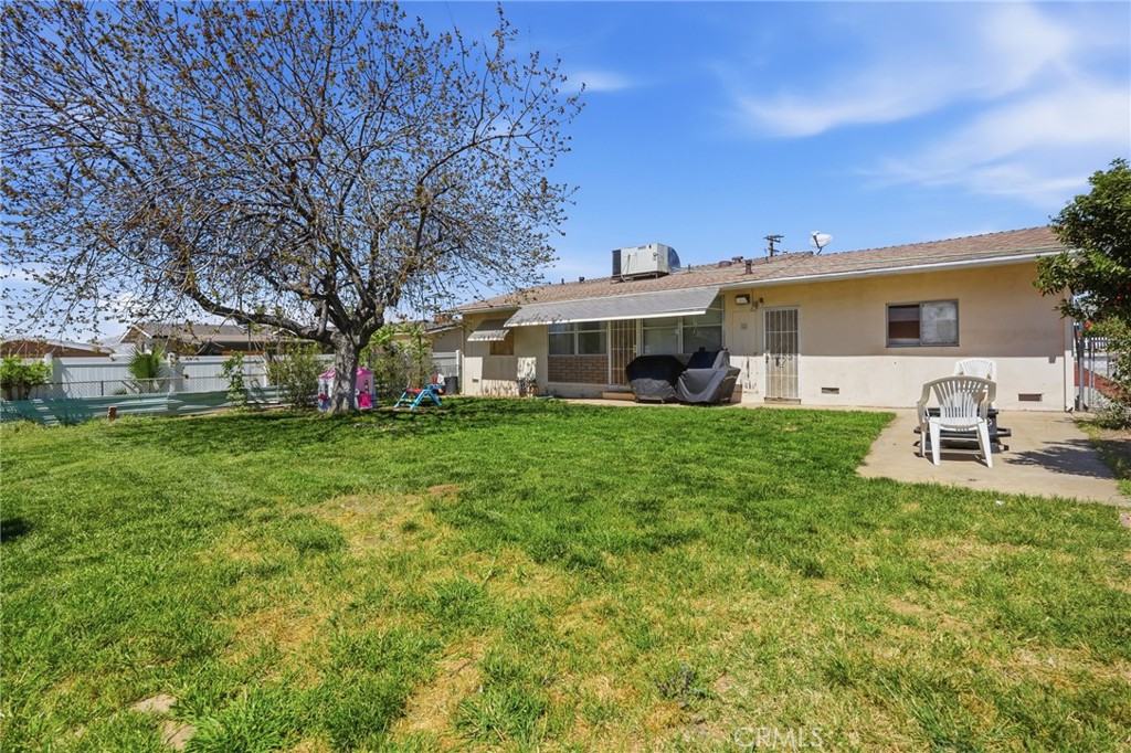 183 East County Line Road Calimesa, CA 92320 - Photo 21 of 31 a front view of a house with a garden and trees