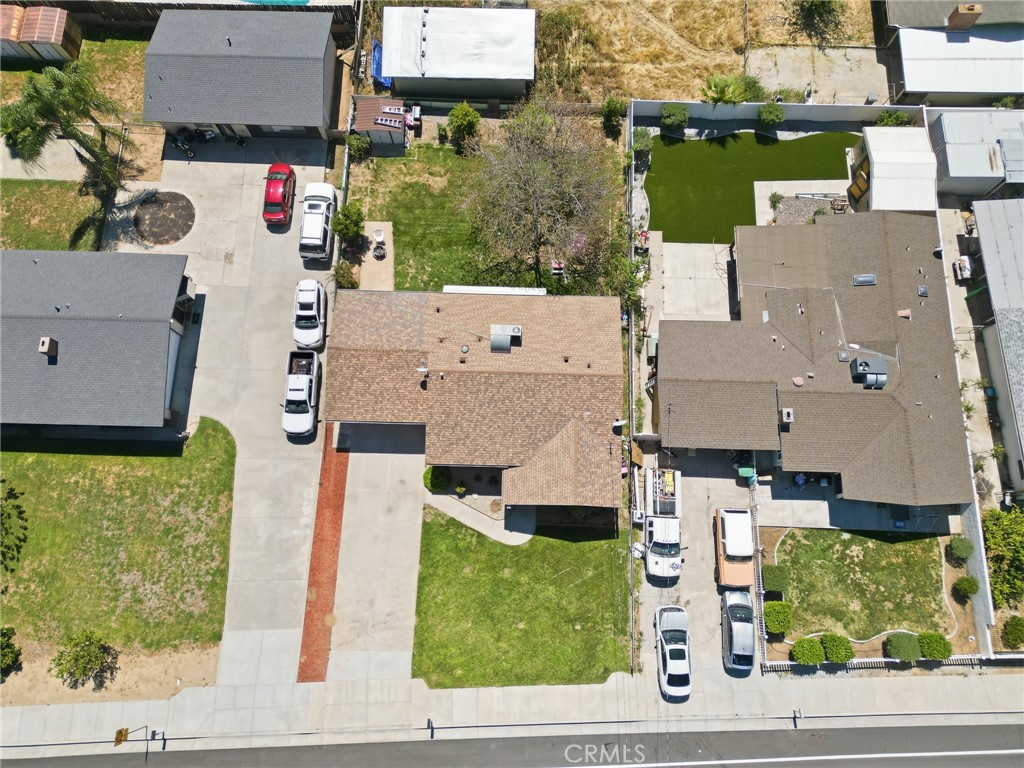 183 East County Line Road Calimesa, CA 92320 - Photo 26 of 31 an aerial view of residential houses with outdoor space and parking