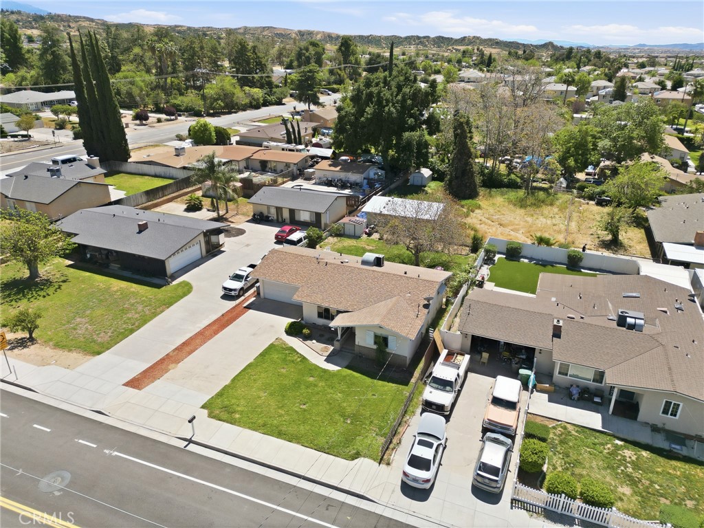 183 East County Line Road Calimesa, CA 92320 - Photo 27 of 31 an aerial view of a house with a garden and lake view