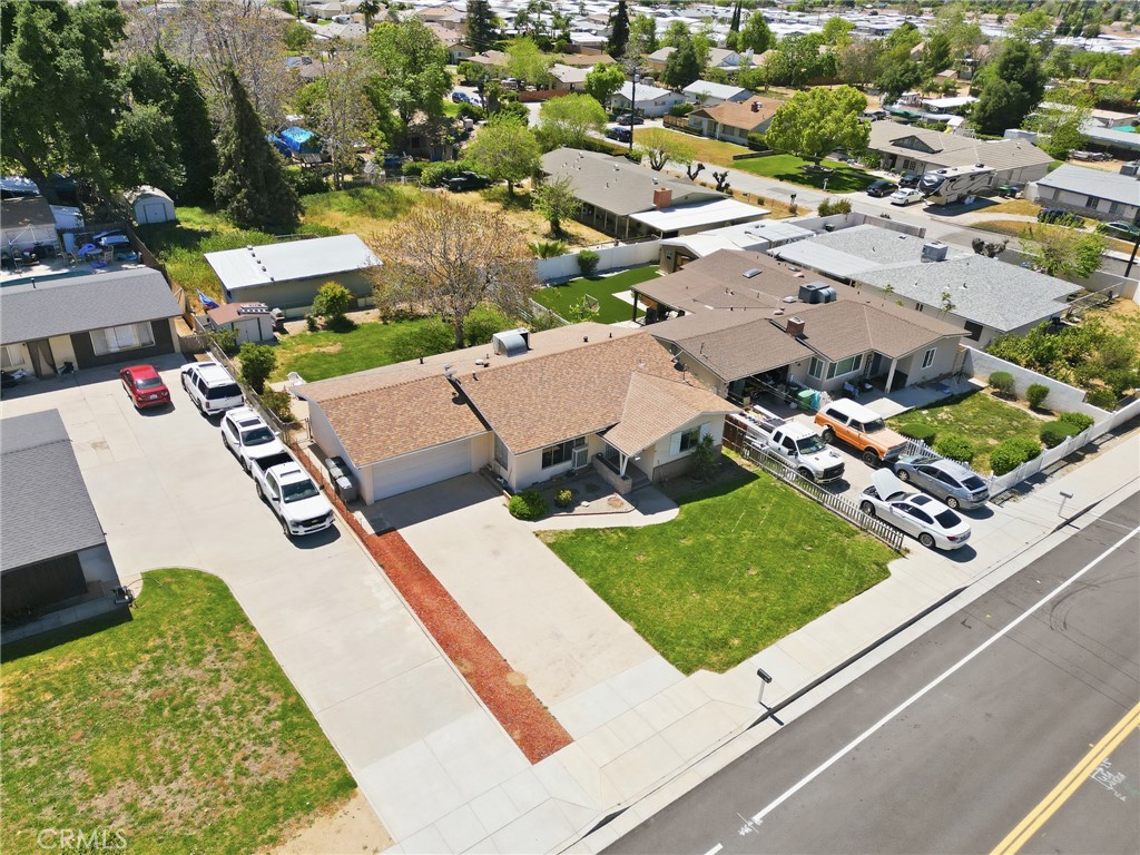 183 East County Line Road Calimesa, CA 92320 - Photo 28 of 31 an aerial view of a house with a garden and swimming pool