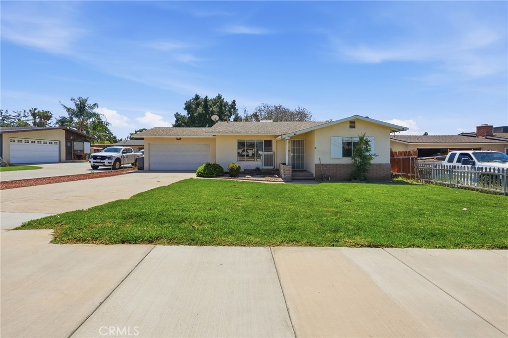 183 East County Line Road Calimesa, CA 92320 - Photo 30 of 31 a front view of a house with a yard and garage