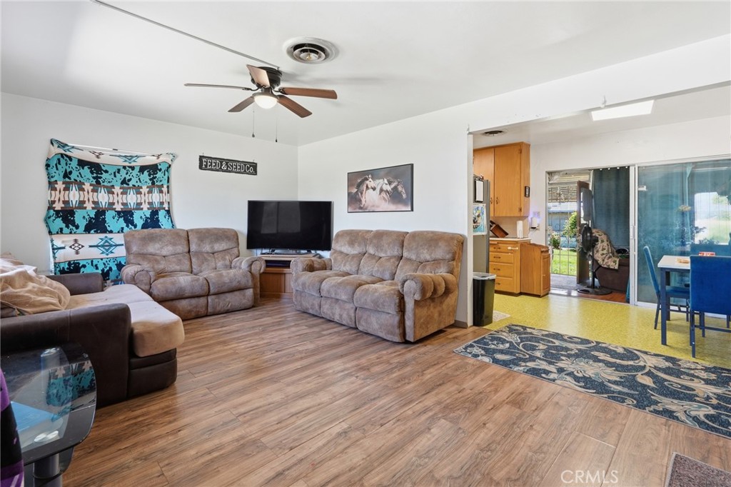 183 East County Line Road Calimesa, CA 92320 - Photo 3 of 31 a living room with furniture and a wooden floor