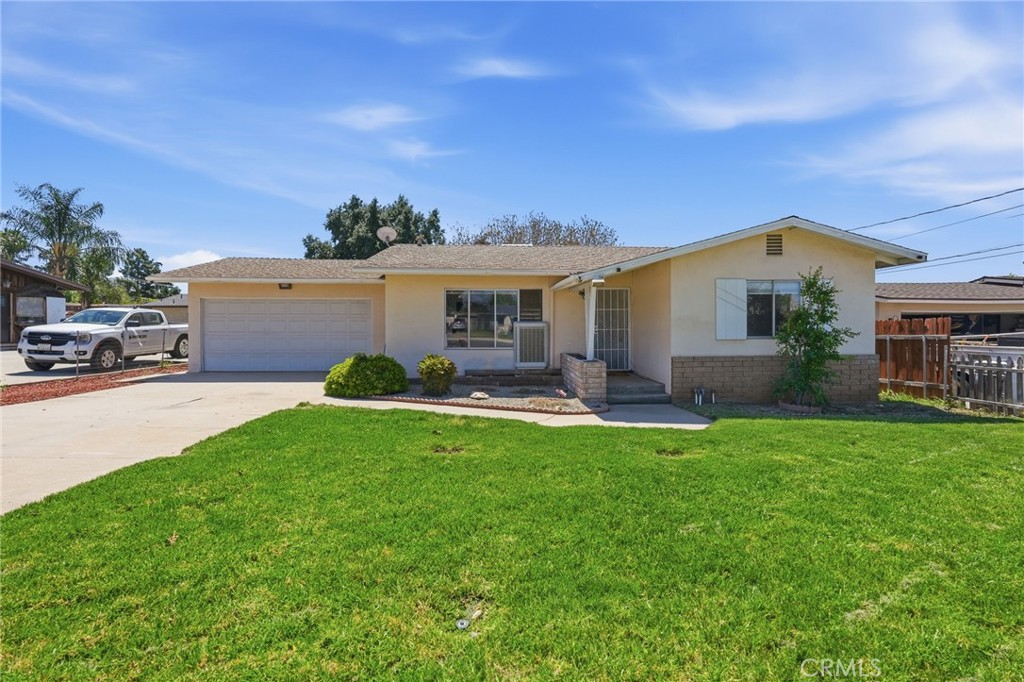 183 East County Line Road Calimesa, CA 92320 - Photo 31 of 31 a front view of a house with a garden and plants