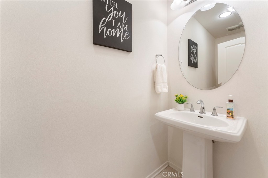 869 East Mountain Way, Unit D Azusa, CA 91702 - Photo 14 of 55 a bathroom with a sink and a mirror