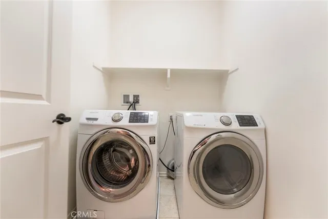 a spacious bathroom with a granite countertop sink a mirror a shower and a bathtub