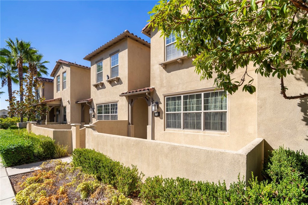 869 East Mountain Way, Unit D Azusa, CA 91702 - Photo 2 of 55 a front view of a house with a yard