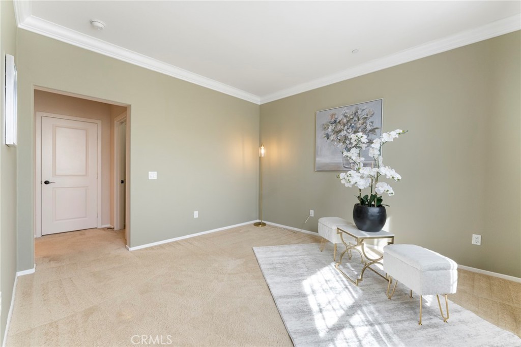 869 East Mountain Way, Unit D Azusa, CA 91702 - Photo 22 of 55 a view of a room with a chandelier fan and wooden floor