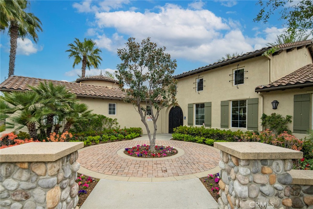 869 East Mountain Way, Unit D Azusa, CA 91702 - Photo 43 of 55 a front view of a house with garden