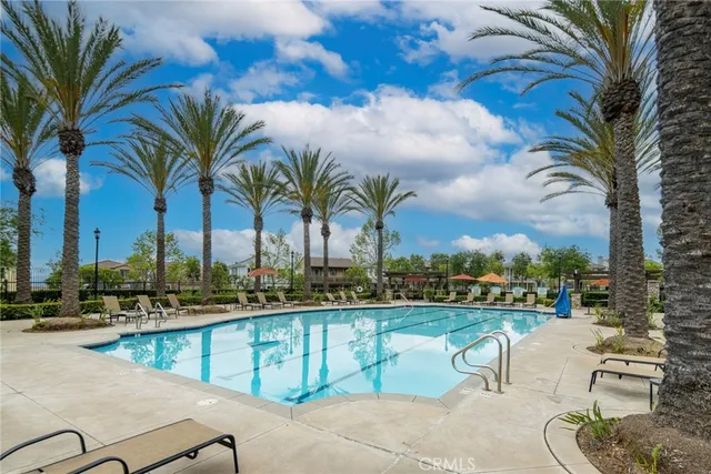 a view of a house with a yard and potted plants