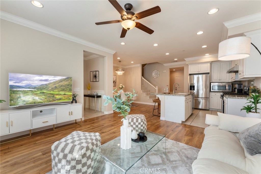869 East Mountain Way, Unit D Azusa, CA 91702 - Photo 6 of 55 a living room with furniture and a flat screen tv