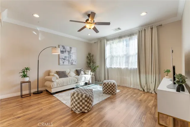 a bedroom with furniture and a large window