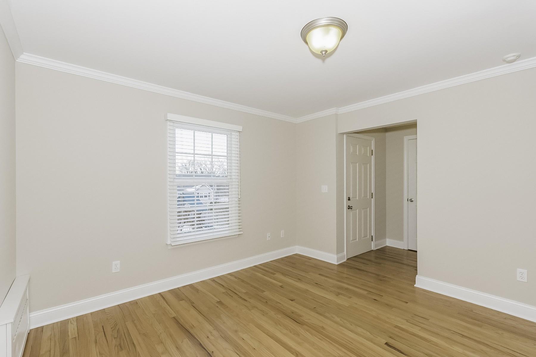 2 Tod Road Norwalk, CT 06851 - Photo 15 of 26 an empty room with wooden floor and windows