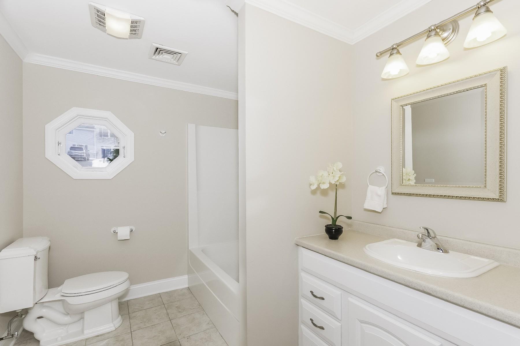 2 Tod Road Norwalk, CT 06851 - Photo 16 of 26 a bathroom with a toilet a sink and mirror