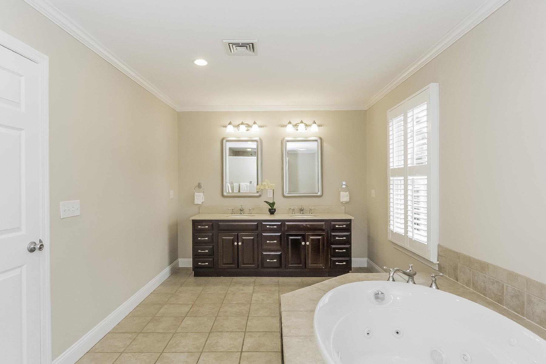 2 Tod Road Norwalk, CT 06851 - Photo 18 of 26 a spacious bathroom with a tub sink and mirror