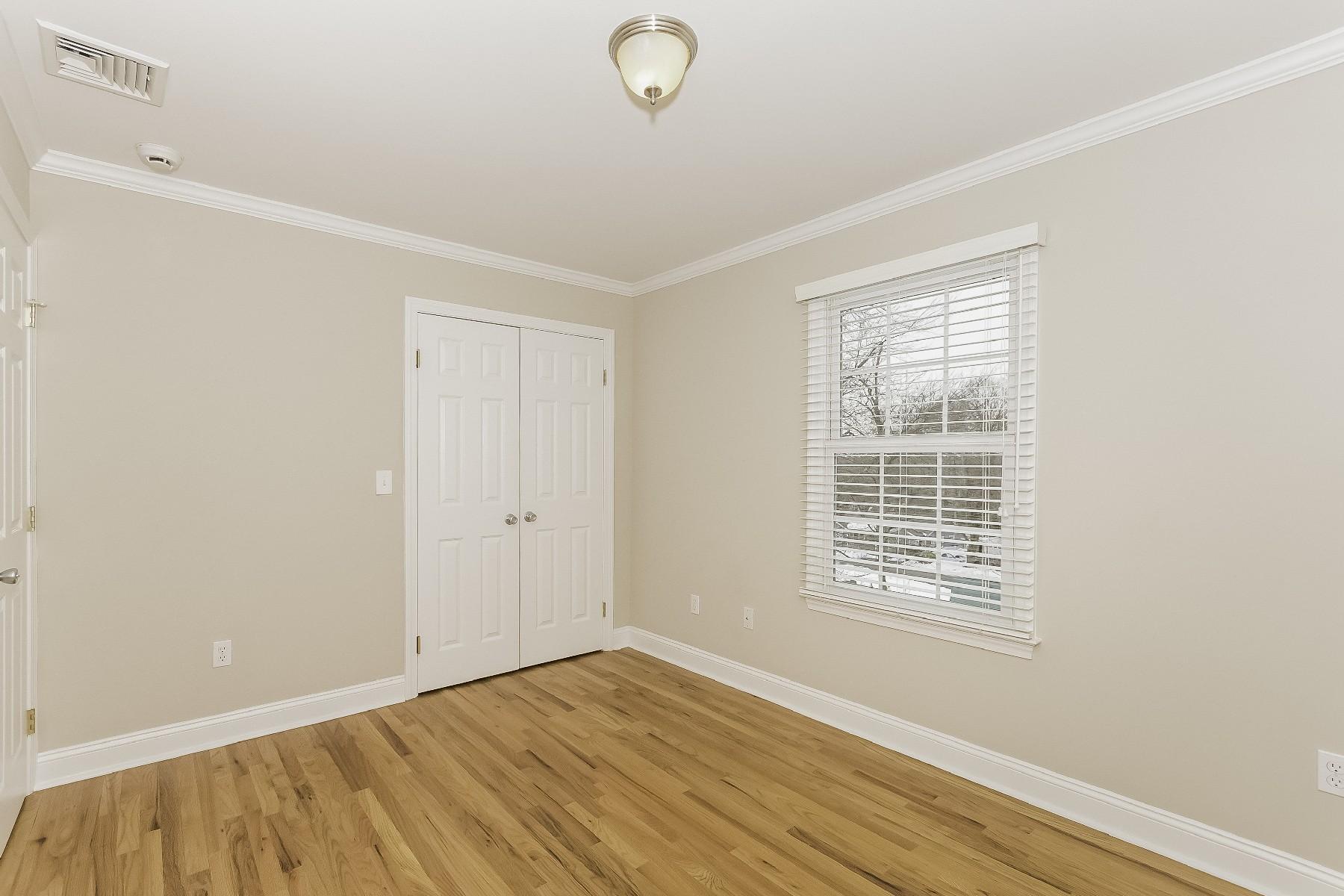 2 Tod Road Norwalk, CT 06851 - Photo 20 of 26 a view of an empty room with wooden floor and a window