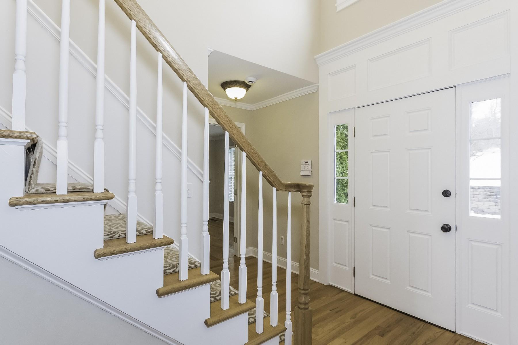 2 Tod Road Norwalk, CT 06851 - Photo 4 of 26 a view of staircase with white walls and windows