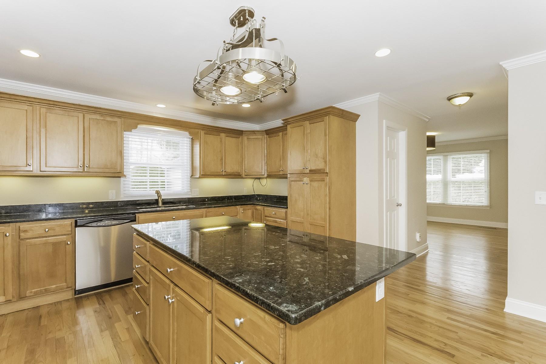 2 Tod Road Norwalk, CT 06851 - Photo 10 of 26 a kitchen with stainless steel appliances granite countertop a sink window and cabinets