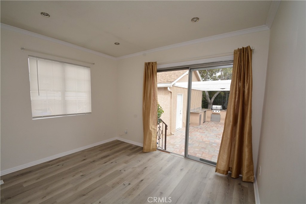 12301 Rives Avenue Downey, CA 90242 - Photo 7 of 20 an empty room with wooden floor and windows