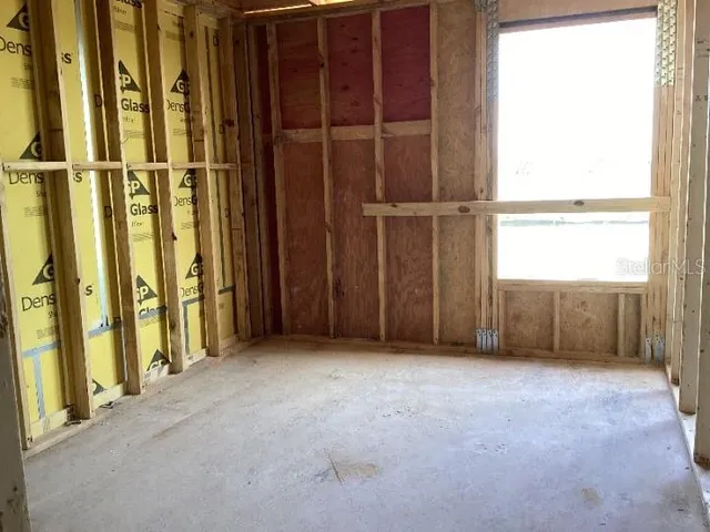 a view of an empty room with a fireplace