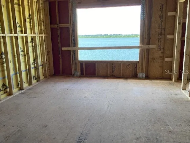 a view of a house with wooden floor and stairs