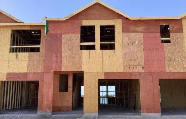 a front view of a house with glass windows