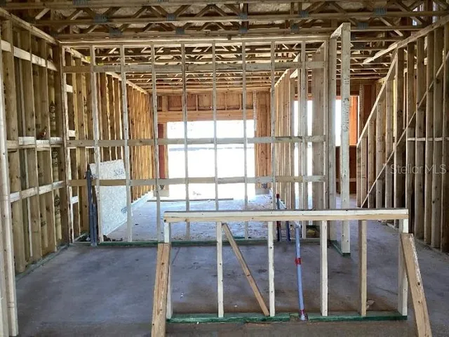 a view of a porch with wooden floor