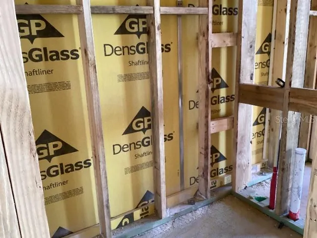 a view of walk in closet with clothes