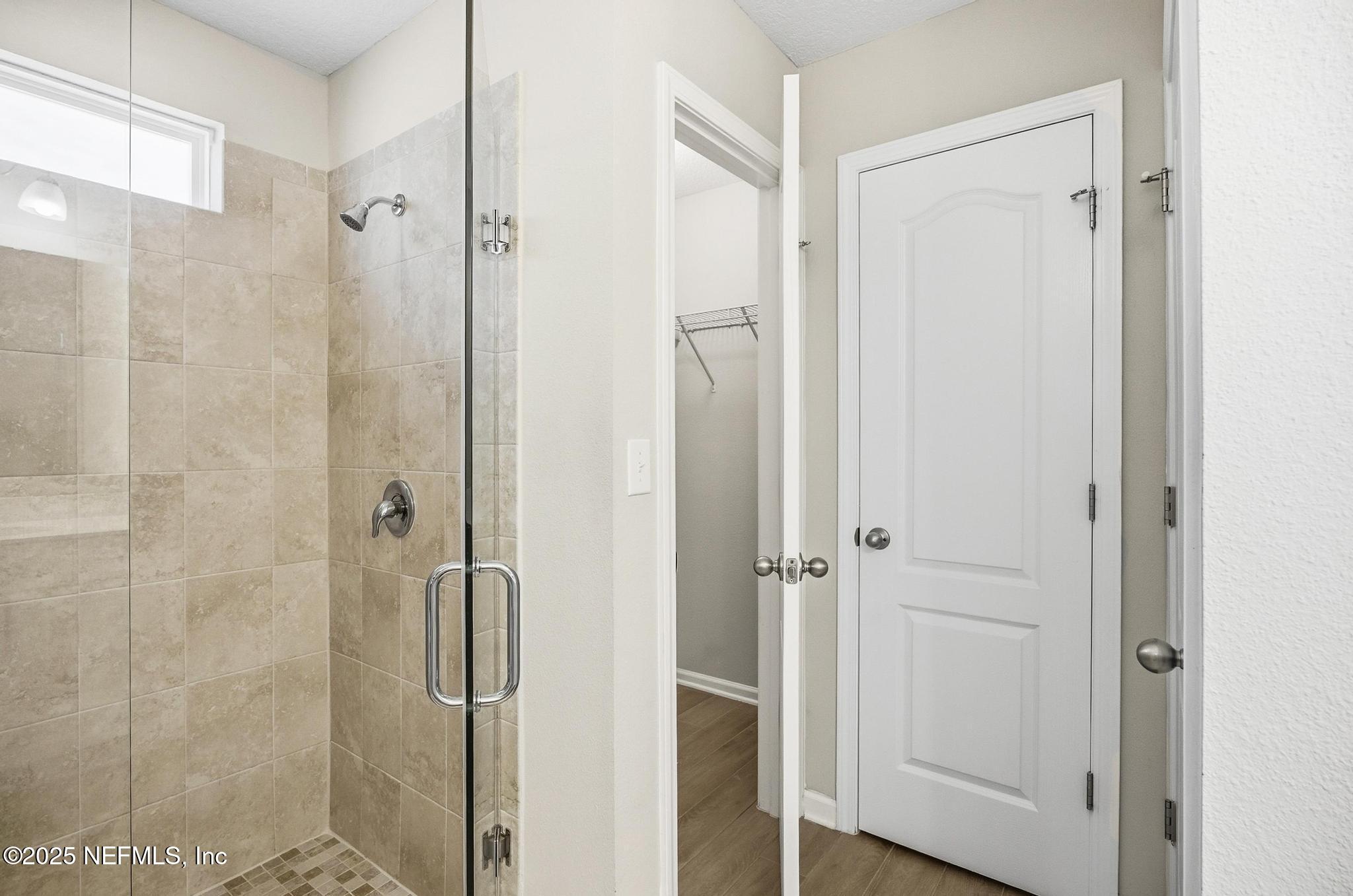 83 Hummingbird Court Palm Coast, FL 32164 - Photo 18 of 70 a bathroom with a shower and a sink