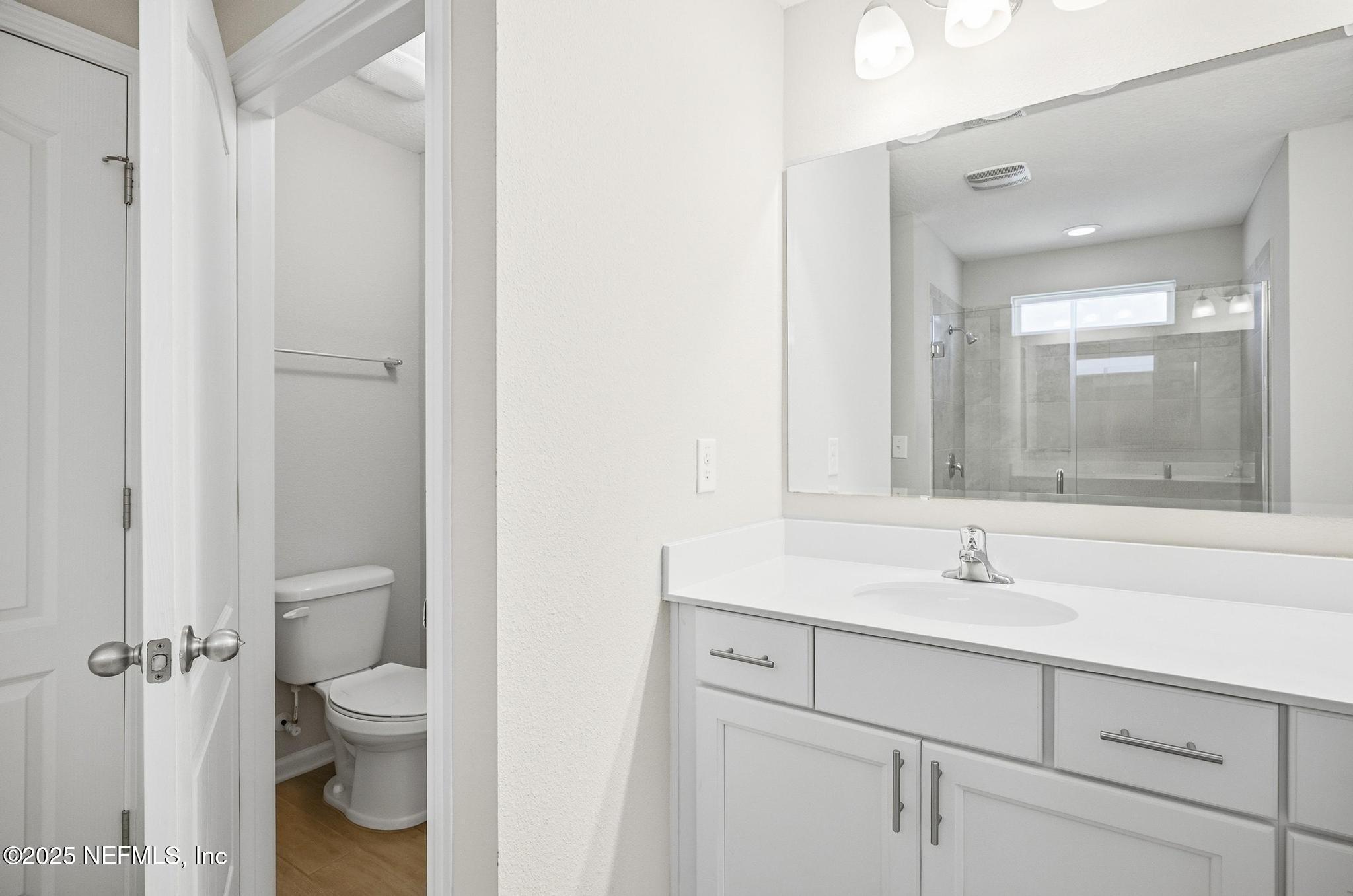 83 Hummingbird Court Palm Coast, FL 32164 - Photo 19 of 70 a bathroom with a sink a toilet and shower
