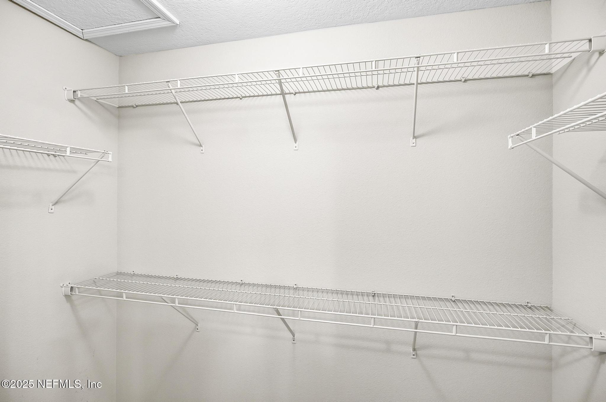 83 Hummingbird Court Palm Coast, FL 32164 - Photo 20 of 70 a view of a room with racks on the wall
