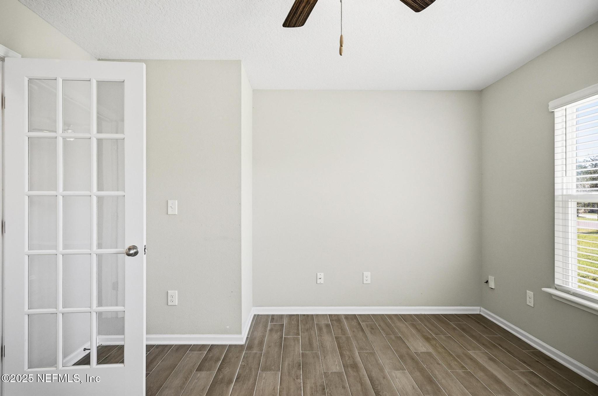 83 Hummingbird Court Palm Coast, FL 32164 - Photo 31 of 70 an empty room with windows