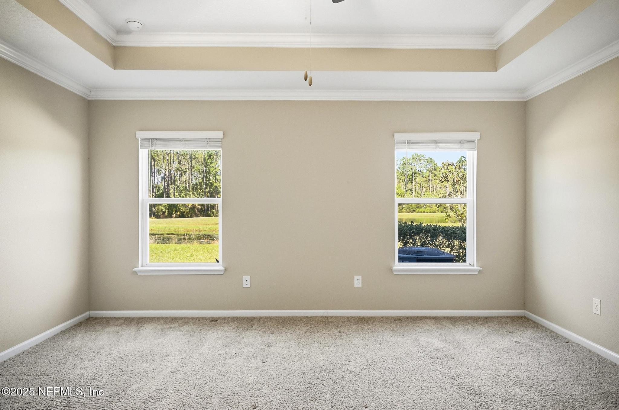 83 Hummingbird Court Palm Coast, FL 32164 - Photo 4 of 70 an empty room with a window