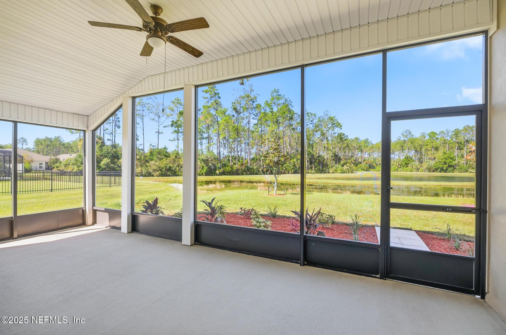 83 Hummingbird Court Palm Coast, FL 32164 - Photo 51 of 70 a view of an empty room with a large window with outer view