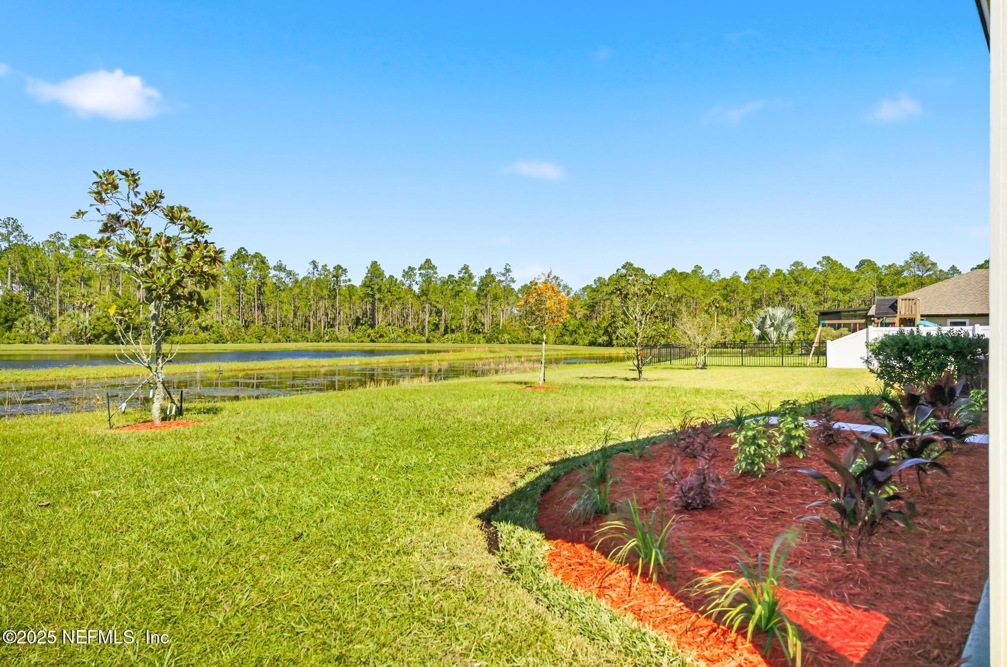 83 Hummingbird Court Palm Coast, FL 32164 - Photo 60 of 70 a view of a swimming pool with an outdoor space and seating area