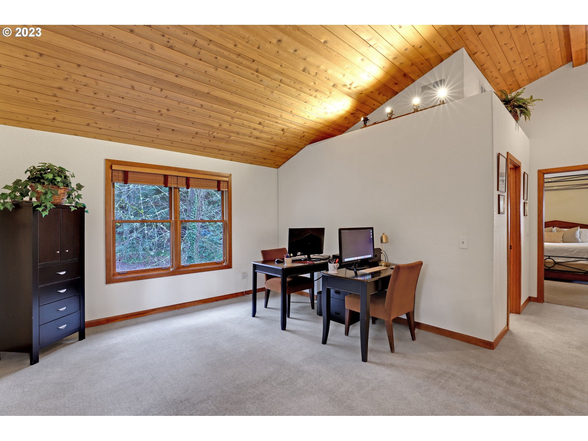 12434 Southwest 57th Avenue Portland, OR 97219 - Photo 18 of 34 a workspace with furniture and a large window