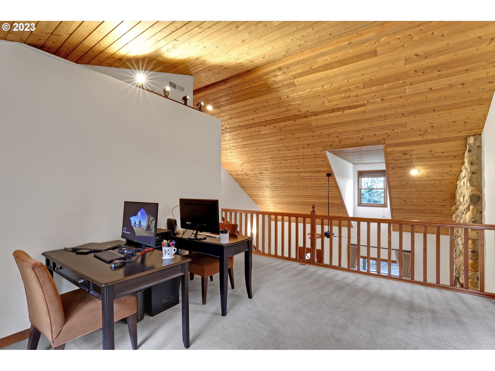 12434 Southwest 57th Avenue Portland, OR 97219 - Photo 19 of 34 a balcony with table and chairs