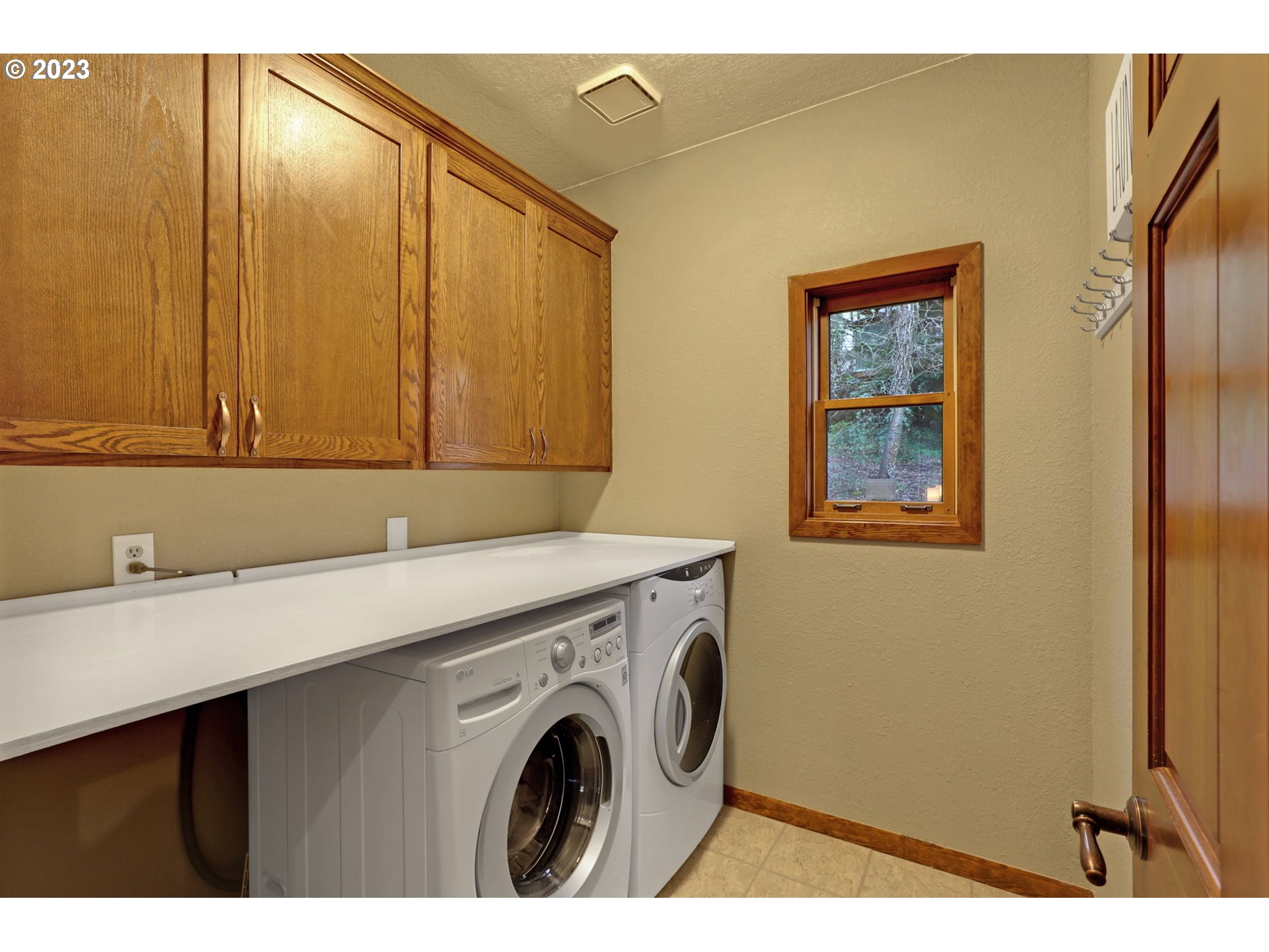 12434 Southwest 57th Avenue Portland, OR 97219 - Photo 22 of 34 a utility room with dryer and washer