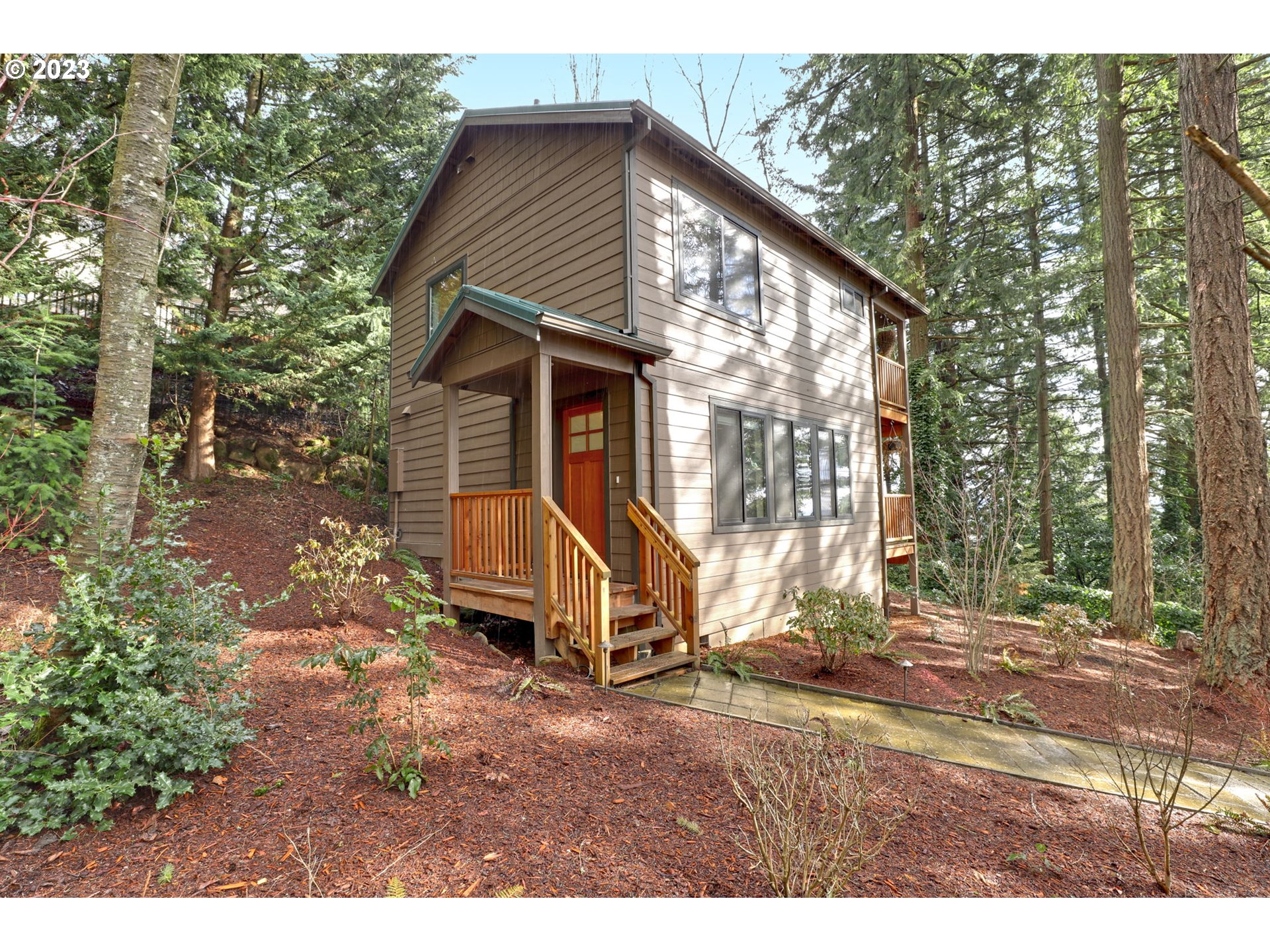 12434 Southwest 57th Avenue Portland, OR 97219 - Photo 24 of 34 a view of a house with a yard