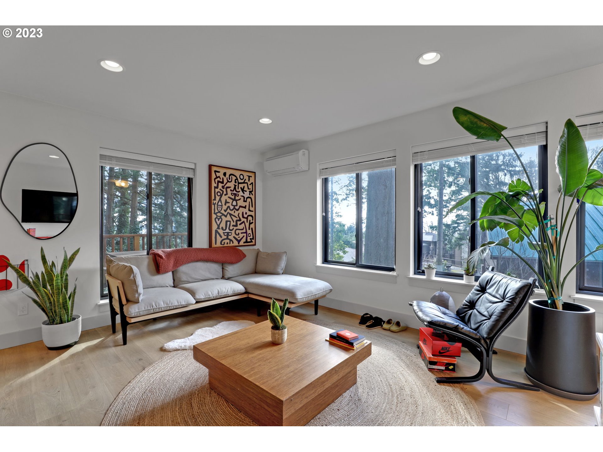 12434 Southwest 57th Avenue Portland, OR 97219 - Photo 25 of 34 a living room with furniture and a large window