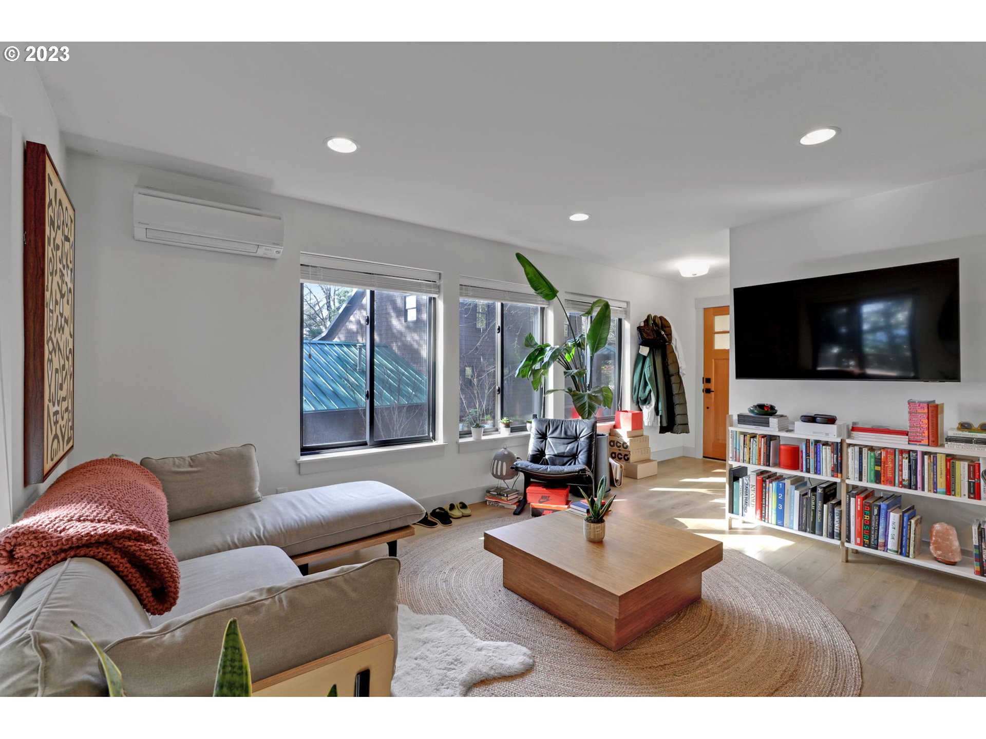 12434 Southwest 57th Avenue Portland, OR 97219 - Photo 26 of 34 a living room with furniture and a flat screen tv