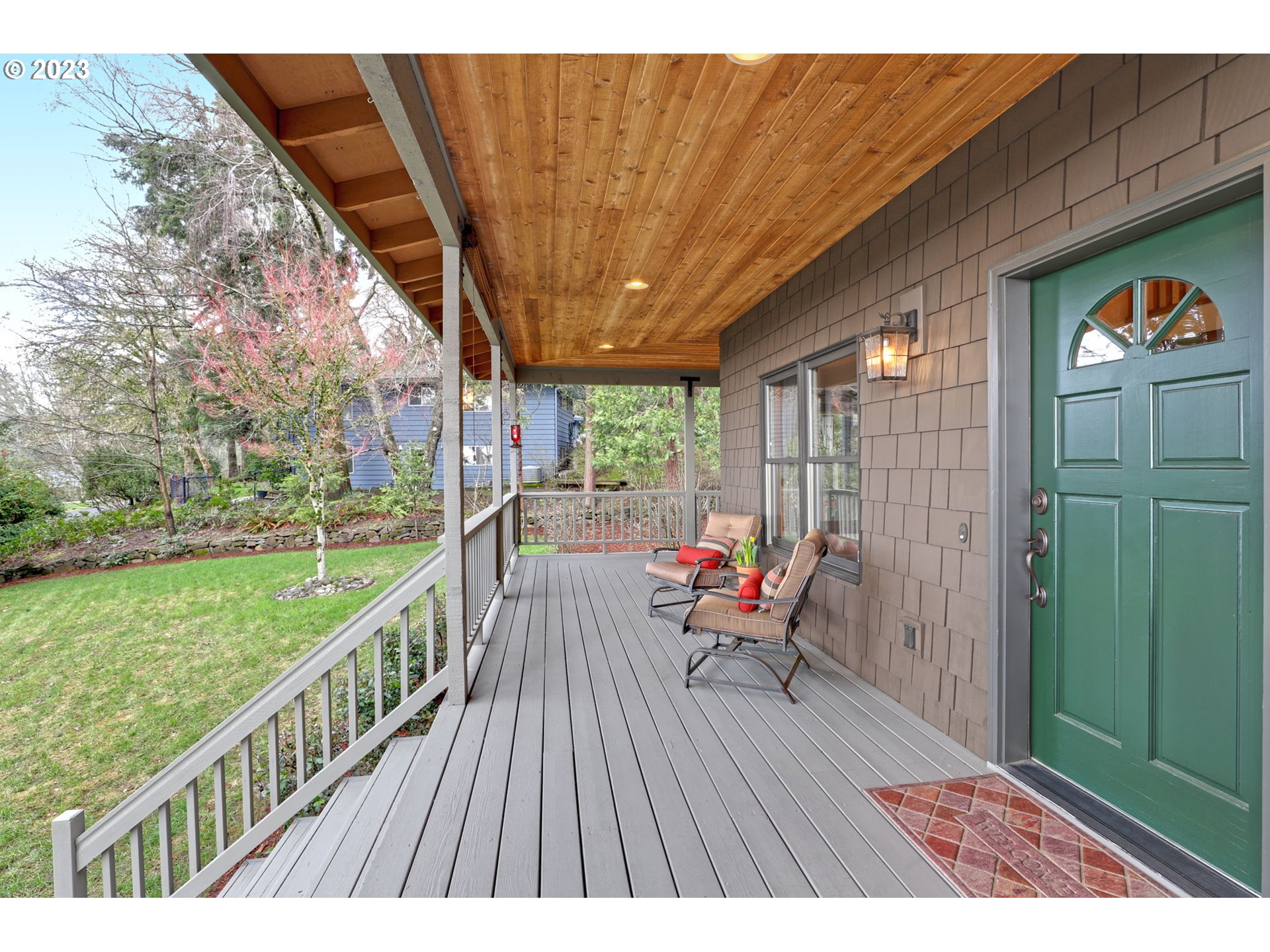 12434 Southwest 57th Avenue Portland, OR 97219 - Photo 3 of 34 a balcony with wooden floor and outdoor seating