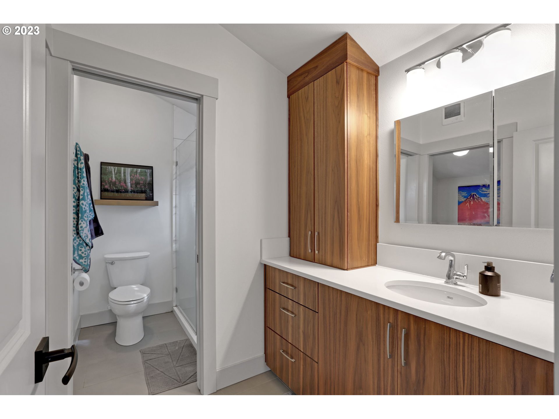 12434 Southwest 57th Avenue Portland, OR 97219 - Photo 31 of 34 a bathroom with a sink and a mirror