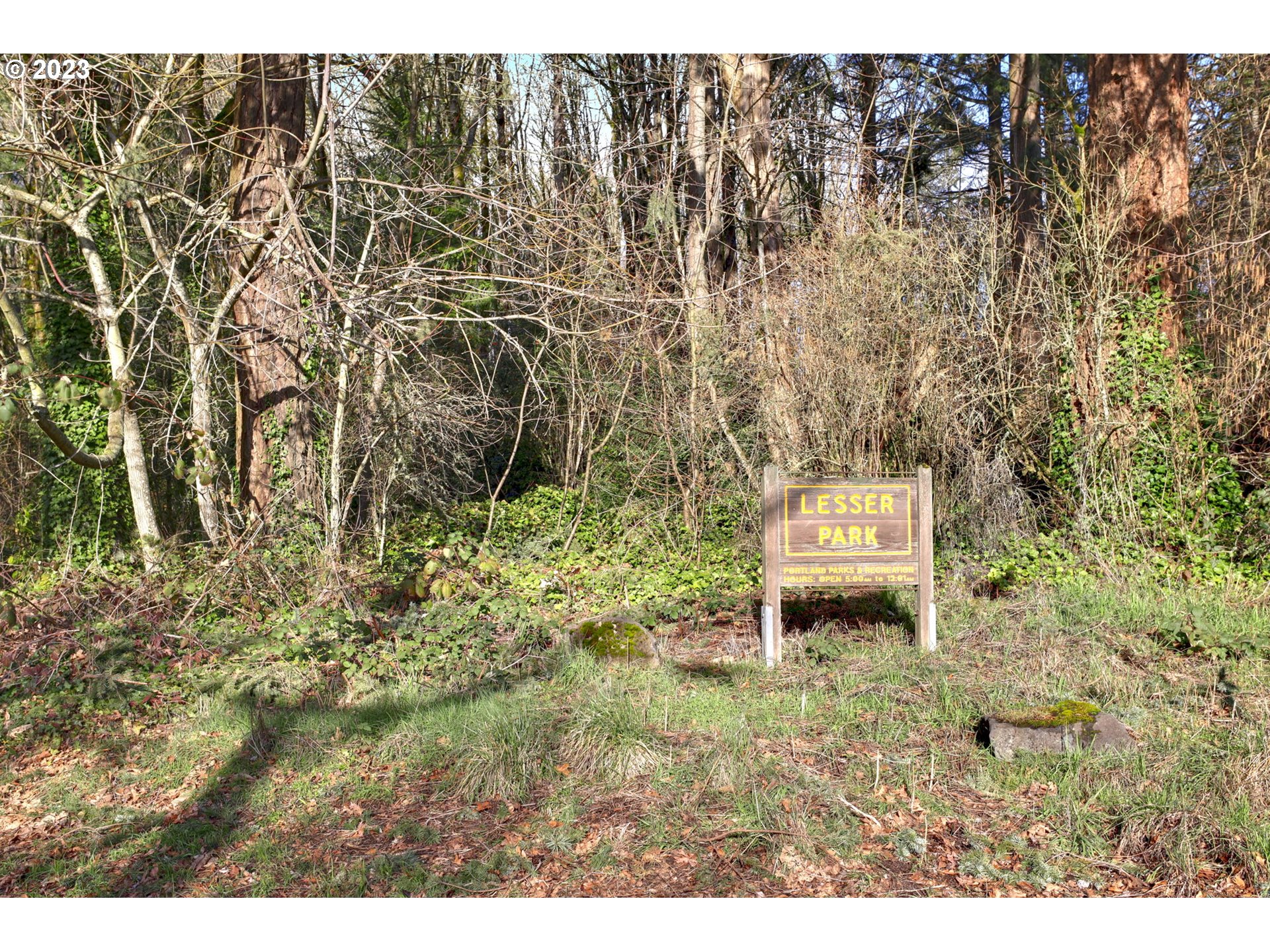 12434 Southwest 57th Avenue Portland, OR 97219 - Photo 33 of 34 a house with a yard