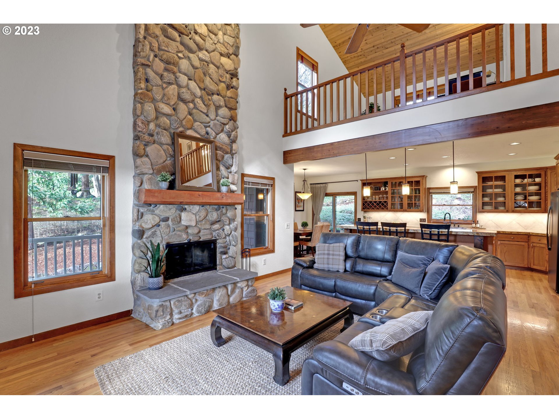 12434 Southwest 57th Avenue Portland, OR 97219 - Photo 7 of 34 a living room with furniture and a fireplace