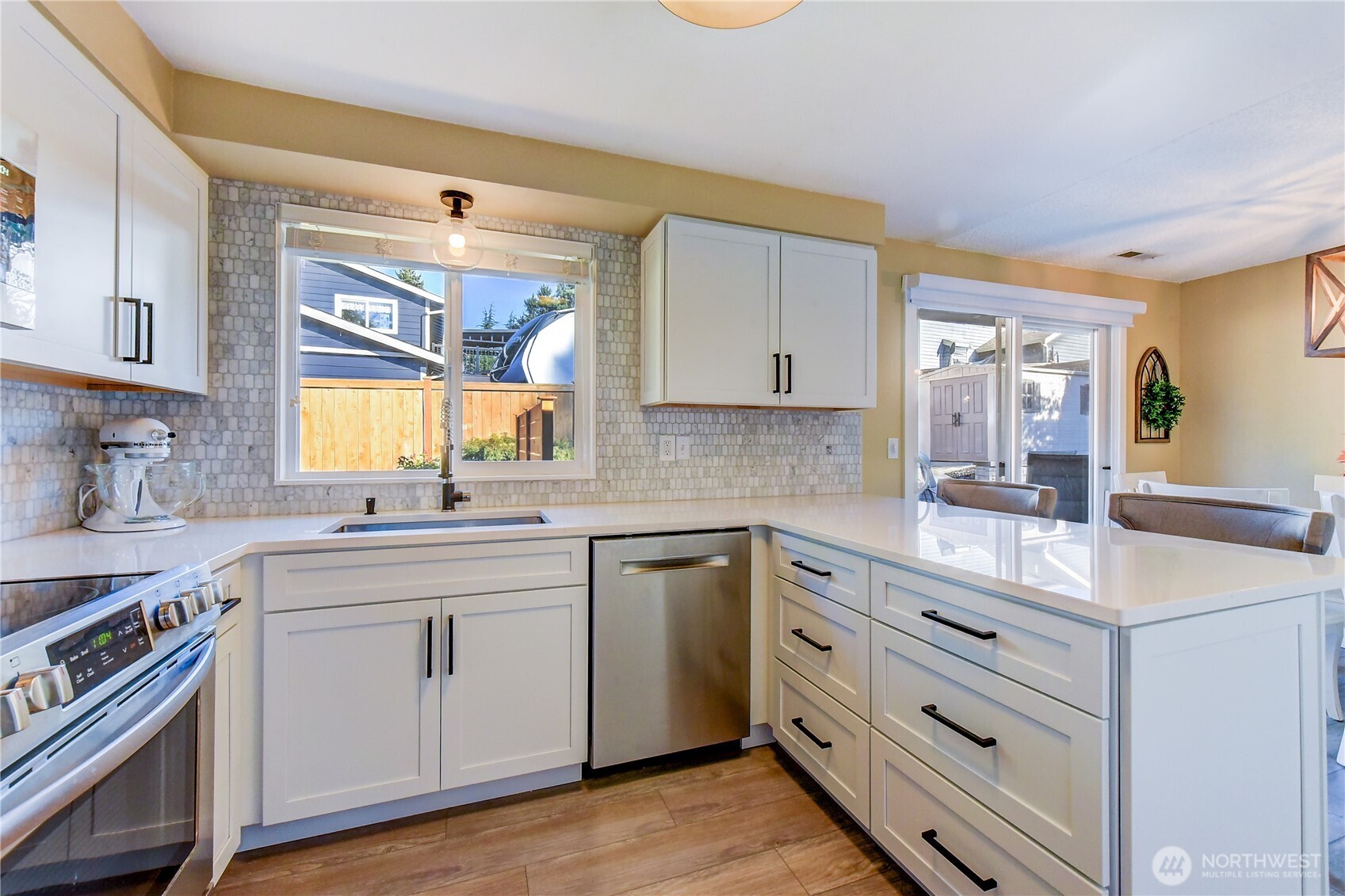 525 218th Street Southwest Bothell, WA 98021 - Photo 12 of 30 a kitchen with a white cabinets and sink