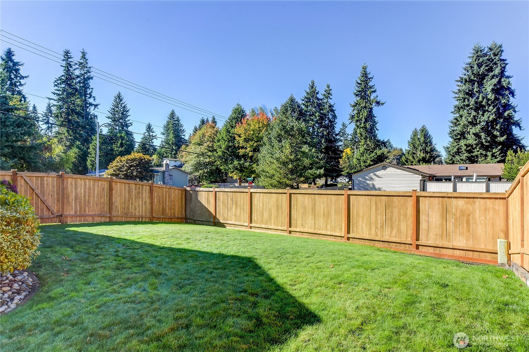 525 218th Street Southwest Bothell, WA 98021 - Photo 27 of 30 a view of backyard with wooden fence