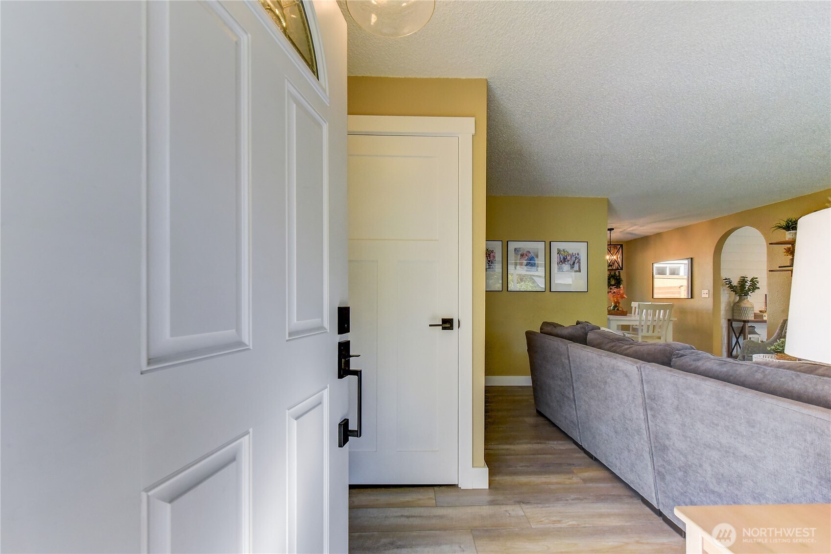 525 218th Street Southwest Bothell, WA 98021 - Photo 4 of 30 a view of a hallway with wooden floor and staircase