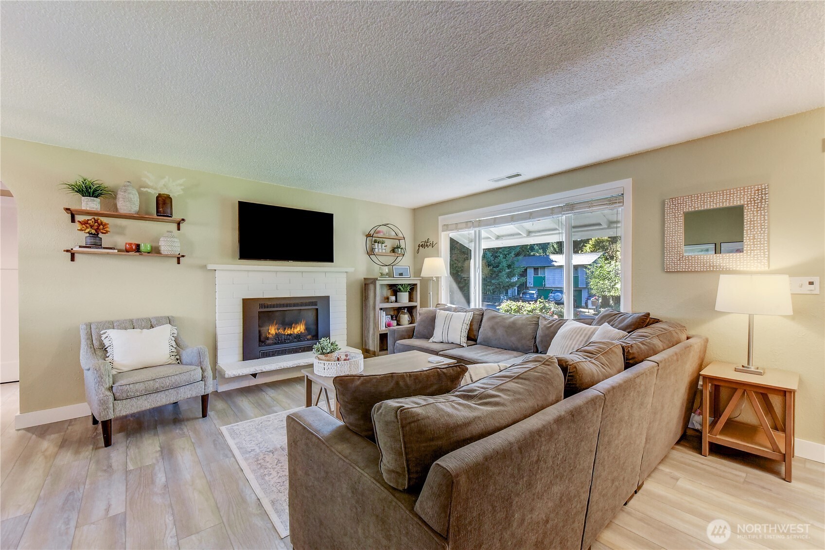 525 218th Street Southwest Bothell, WA 98021 - Photo 5 of 30 a living room with furniture and a fireplace