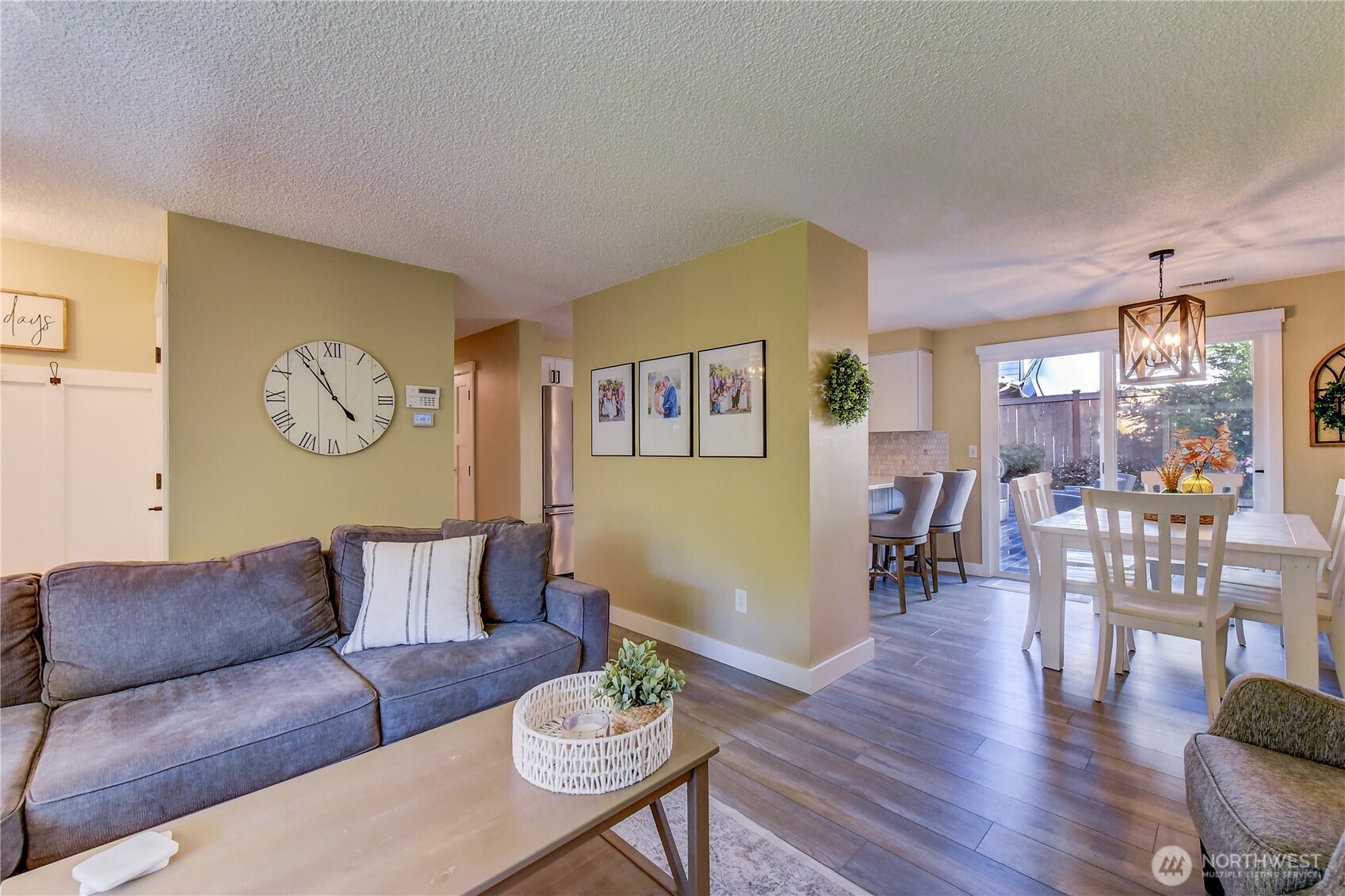 525 218th Street Southwest Bothell, WA 98021 - Photo 7 of 30 a living room with furniture a rug potted plant and a window