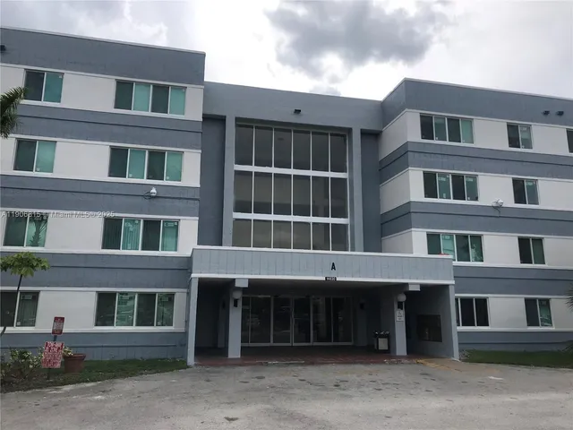 a front view of a building with a lot of windows